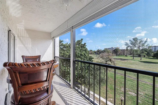 a balcony with chairs