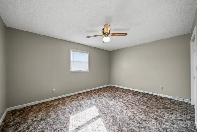 a view of a big room with a window