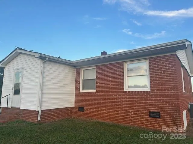 a view of backyard with a garden and entertaining space