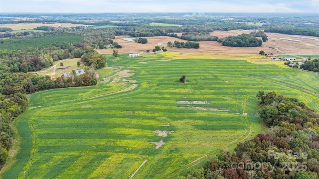 an aerial view of a house with outdoor space
