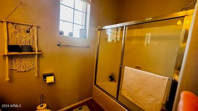 a bathroom with a shower and a sink