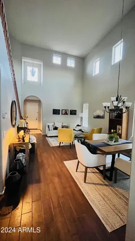 a living room with furniture a rug and a table