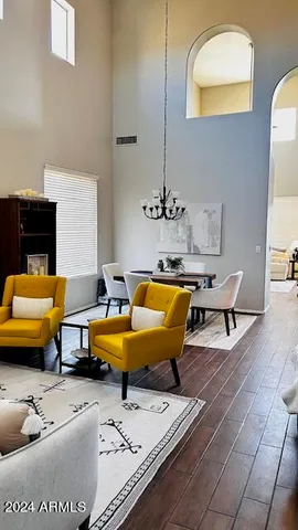 a living room with furniture and a lamp