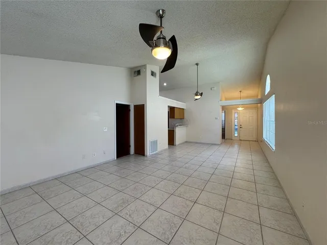 wooden floor in an empty room and a window