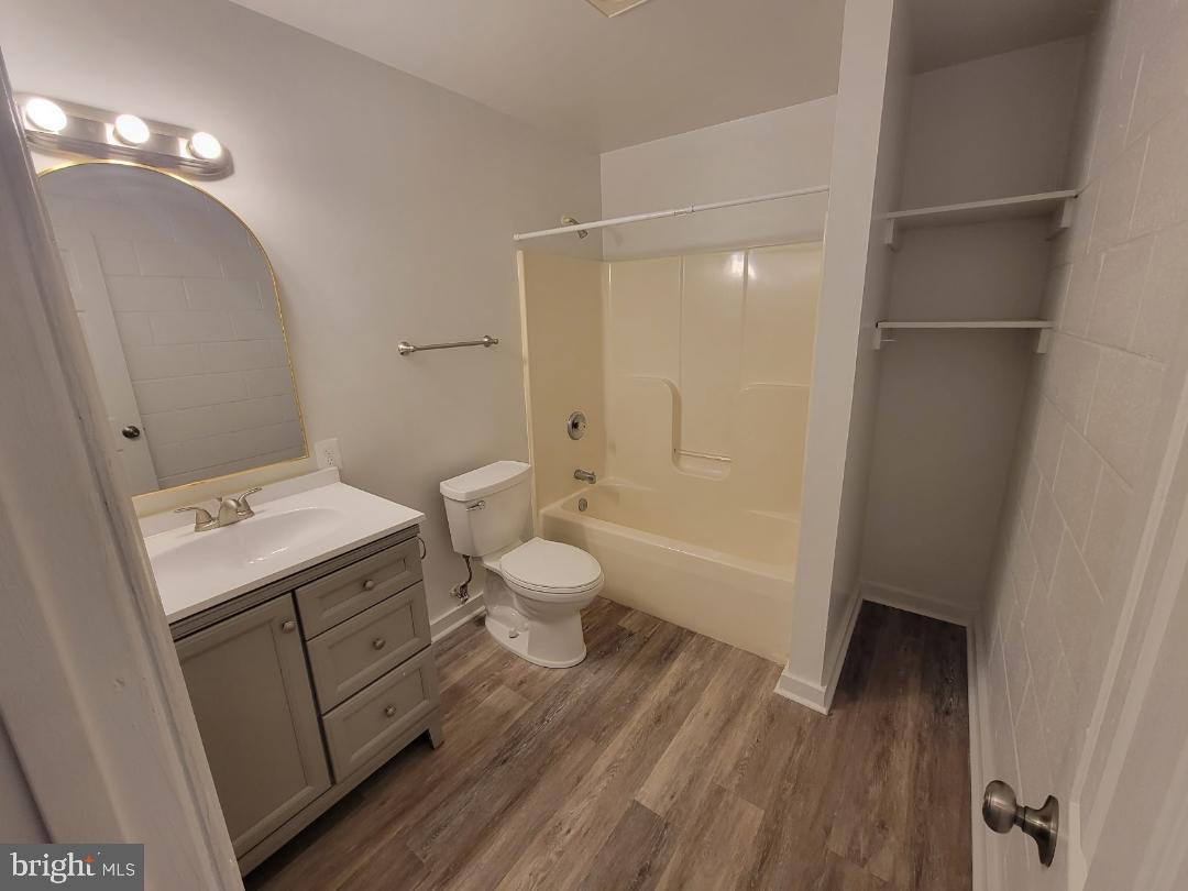 138 Harryhogan Road, Unit 13 Callao, VA 22435 - Photo 5 of 5 a bathroom with a sink a toilet and shower