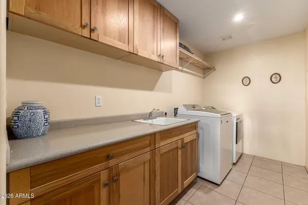a utility room with cabinets