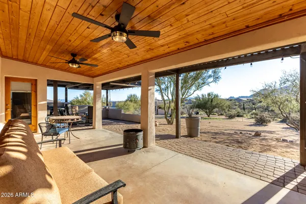 a outdoor living space with furniture and a fireplace