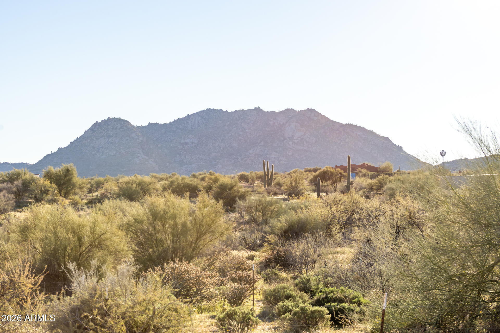 13849 East Hawknest Road Scottsdale, AZ 85262 - Photo 42 of 46 a view of a large building with a mountain in the background