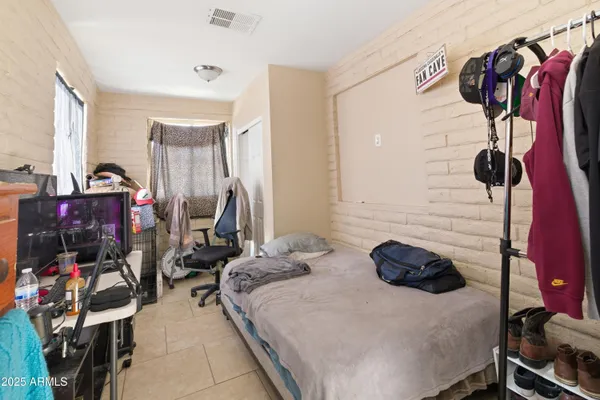 a bed room with furniture and a window