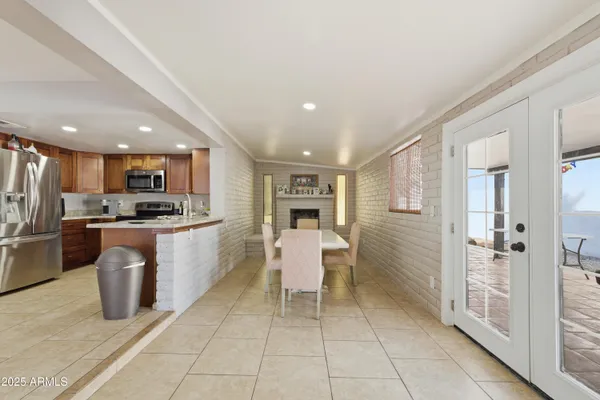 a kitchen with a refrigerator and a sink