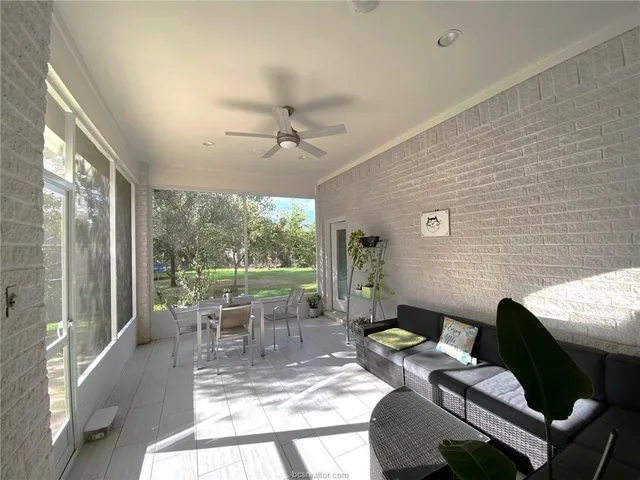 a view of a dining room with furniture wooden floor and chandelier