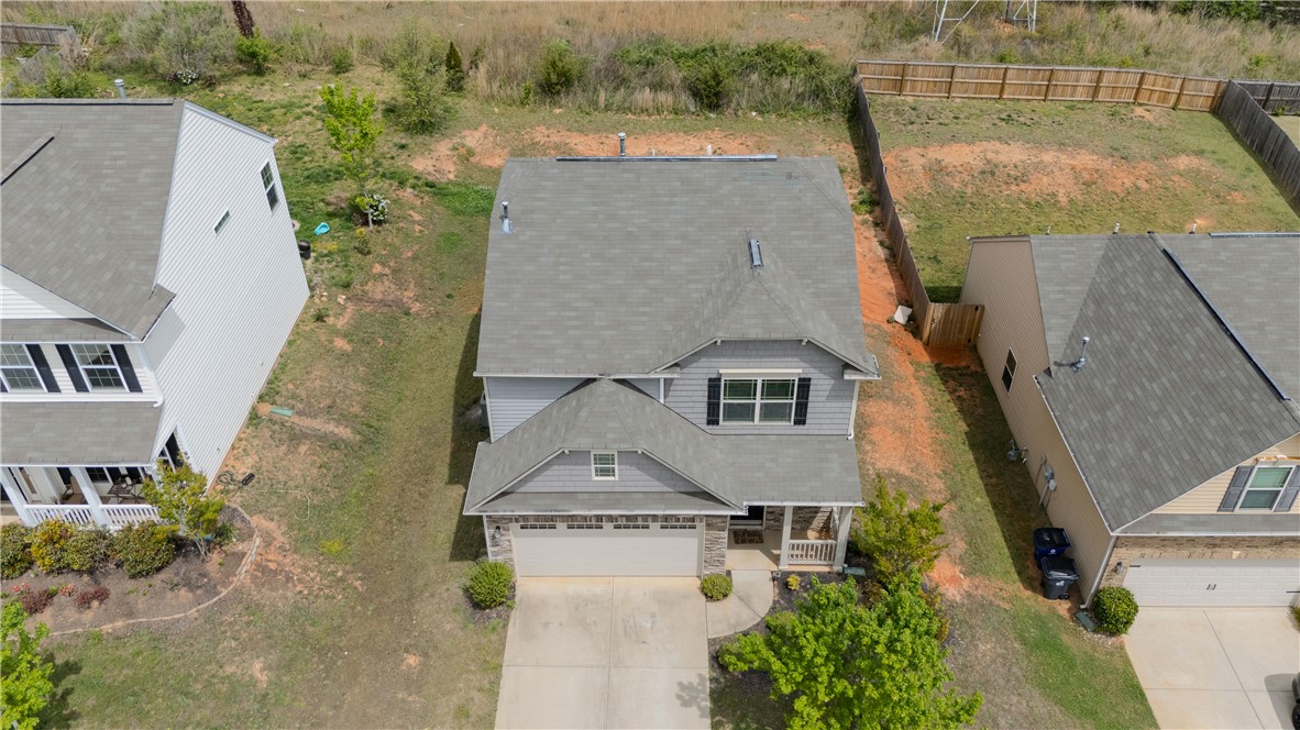 102 Talisker Way Greenville, SC 29607 - Photo 2 of 18 An aerial view captures the home's architecture, showcasing its garage and a manicured front.