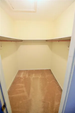 a bathroom with a granite countertop toilet sink and mirror or bathtub