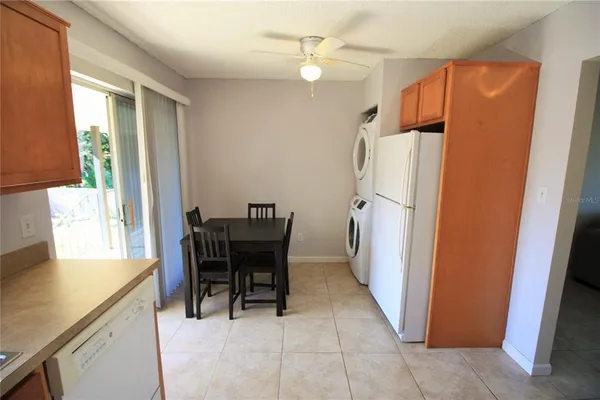 a dining room with furniture and a window