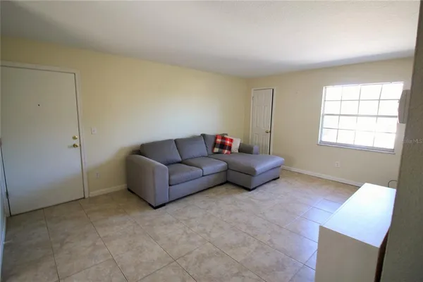 a living room with furniture and a window