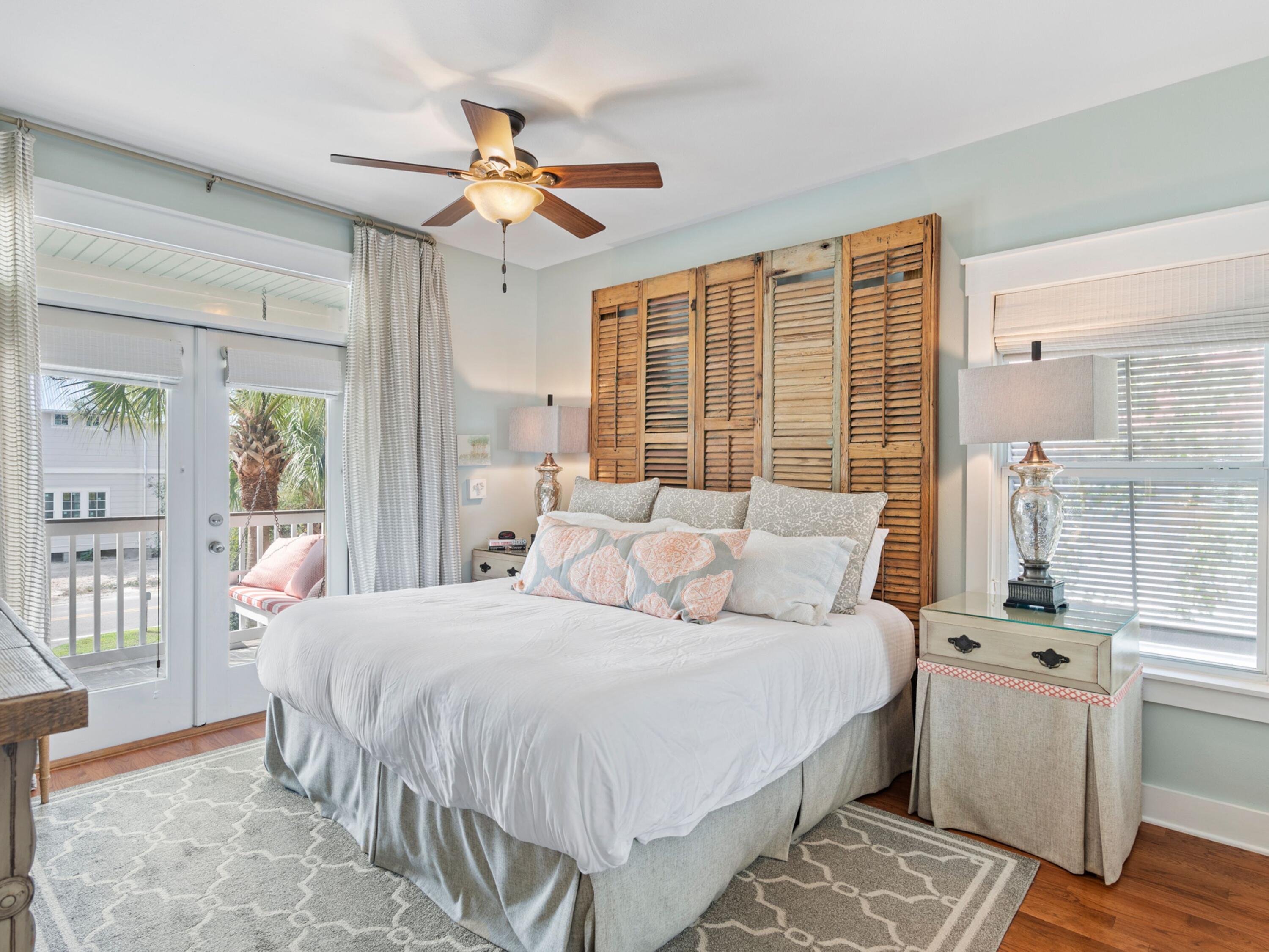 499 Lakeview Drive Santa Rosa Beach, FL 32459 - Photo 16 of 52 a bedroom with a large bed and a chandelier
