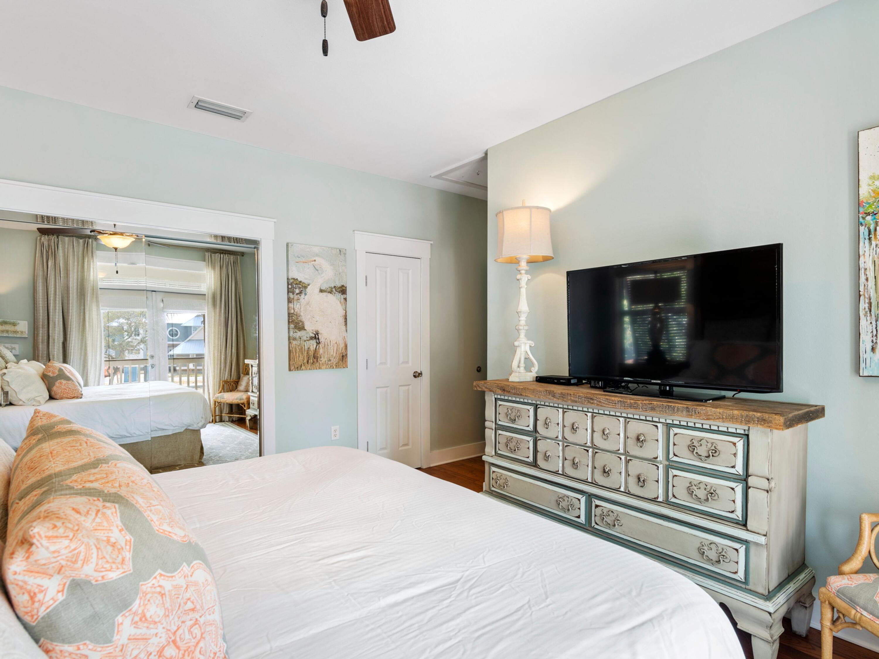 499 Lakeview Drive Santa Rosa Beach, FL 32459 - Photo 17 of 52 a bedroom with a bed and a flat screen tv