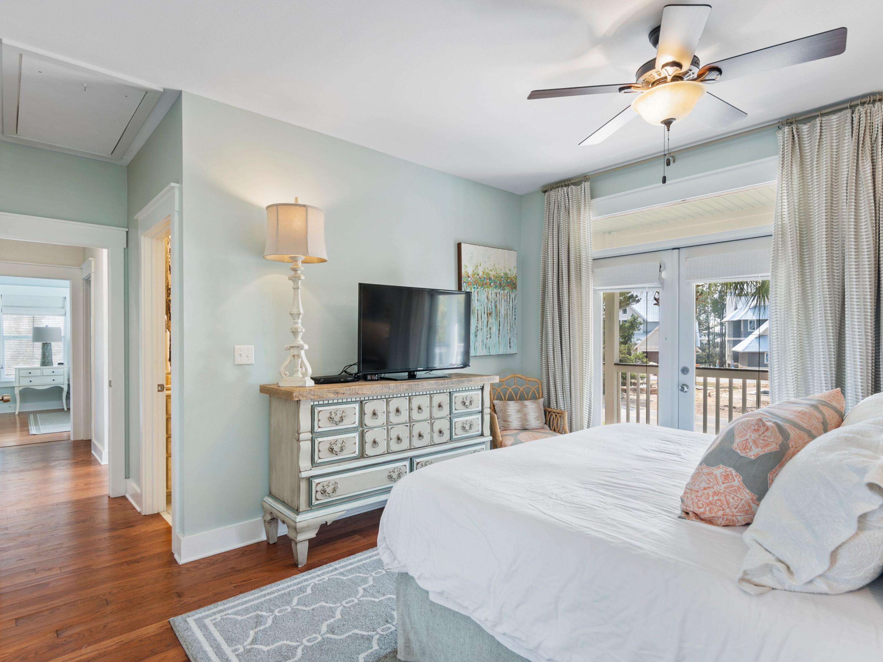 499 Lakeview Drive Santa Rosa Beach, FL 32459 - Photo 18 of 52 a bedroom with a bed and a flat screen tv