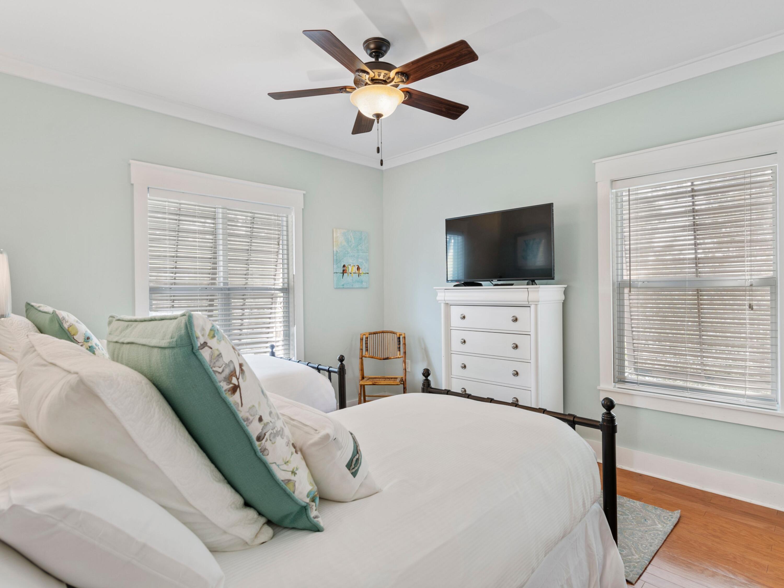 499 Lakeview Drive Santa Rosa Beach, FL 32459 - Photo 21 of 52 a bedroom with a bed a window and a flat screen tv