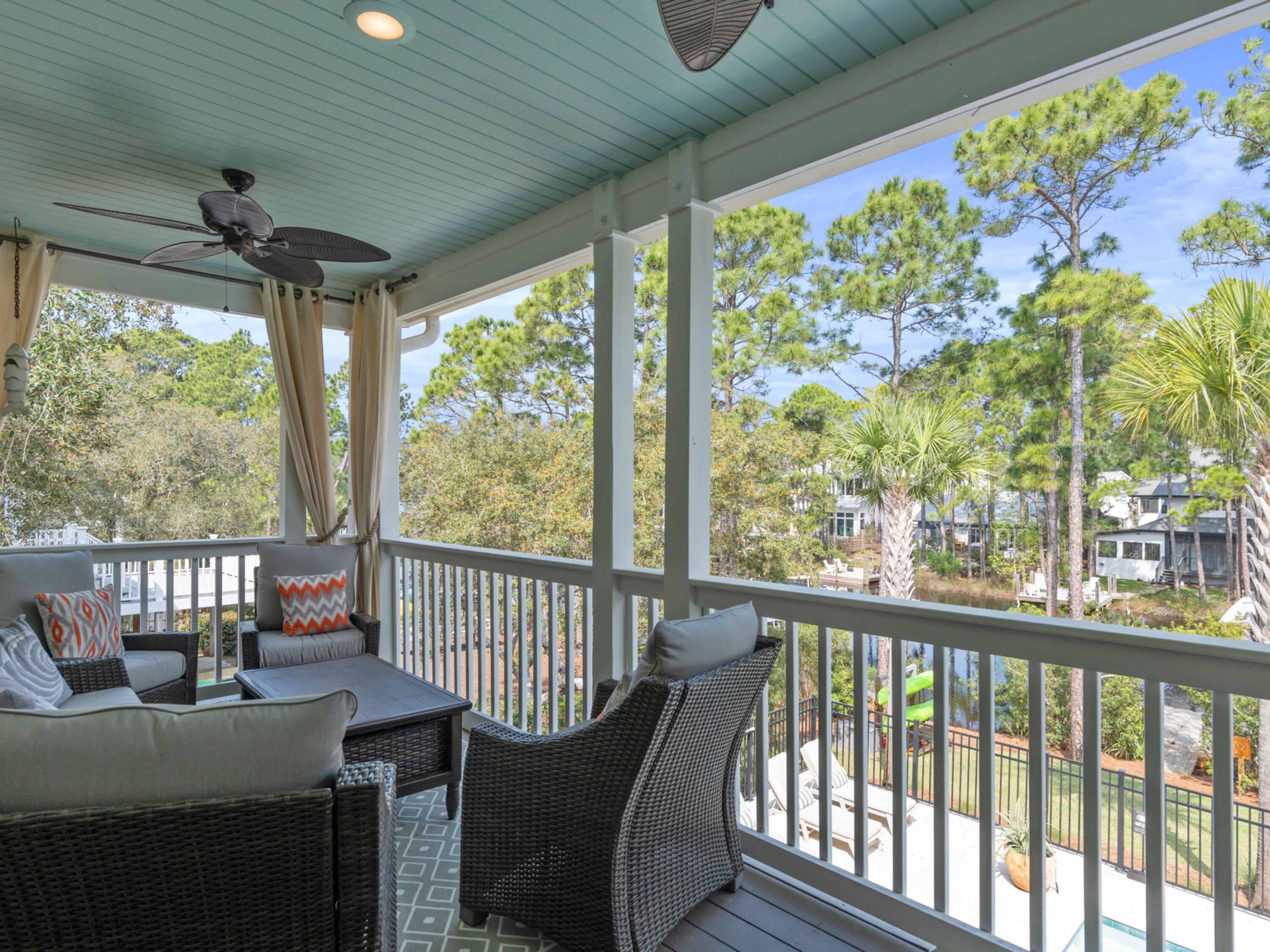 499 Lakeview Drive Santa Rosa Beach, FL 32459 - Photo 22 of 52 a view of a porch with furniture and a yard