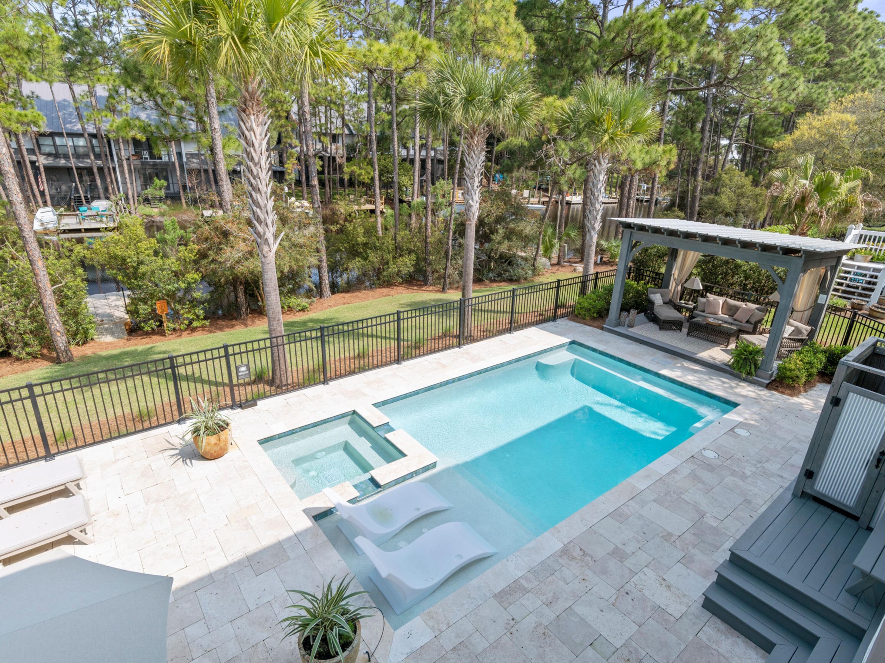 499 Lakeview Drive Santa Rosa Beach, FL 32459 - Photo 23 of 52 a view of a backyard with porch and hardwood
