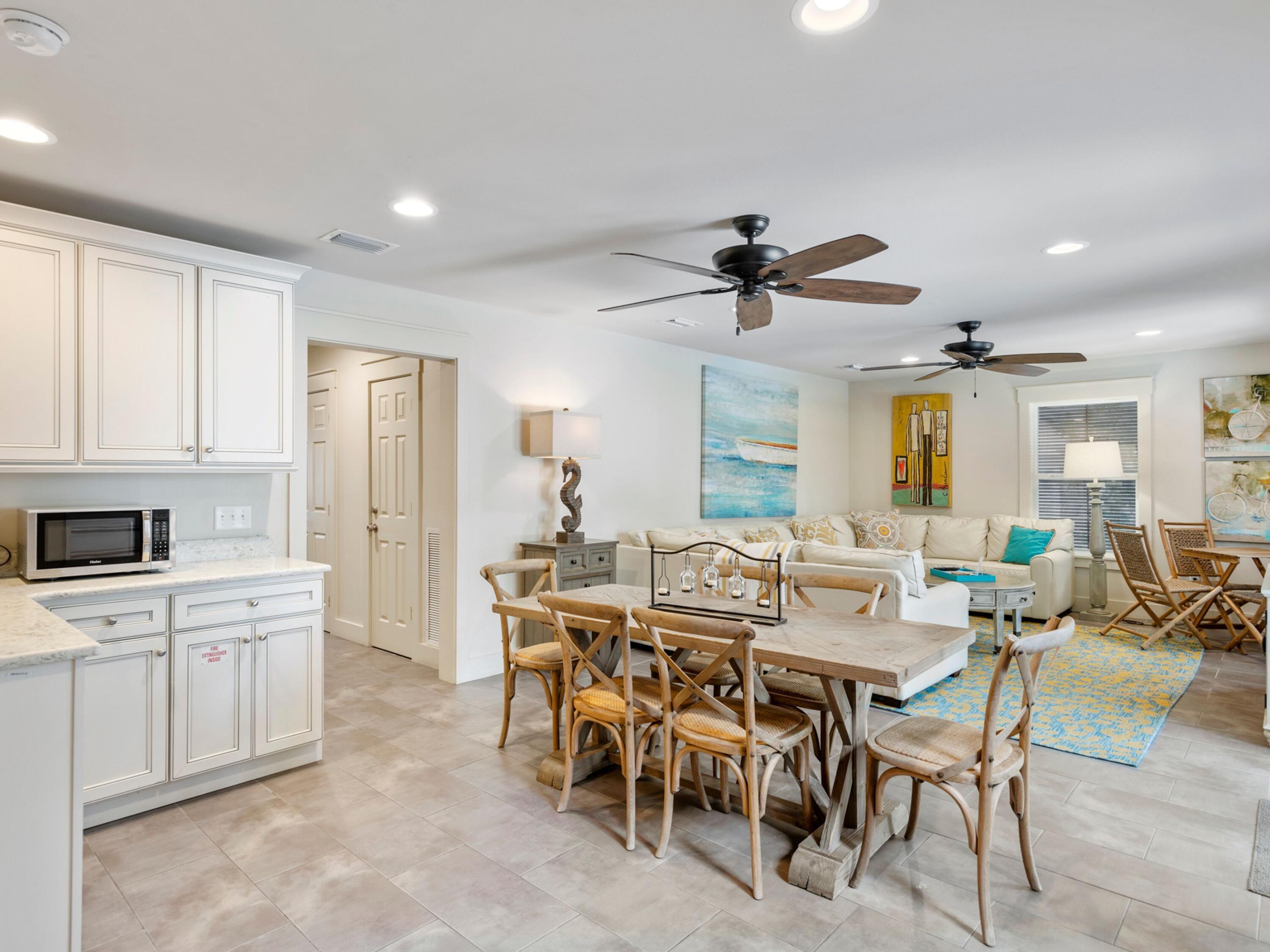 499 Lakeview Drive Santa Rosa Beach, FL 32459 - Photo 26 of 52 a view of a dining room with furniture and a chandelier