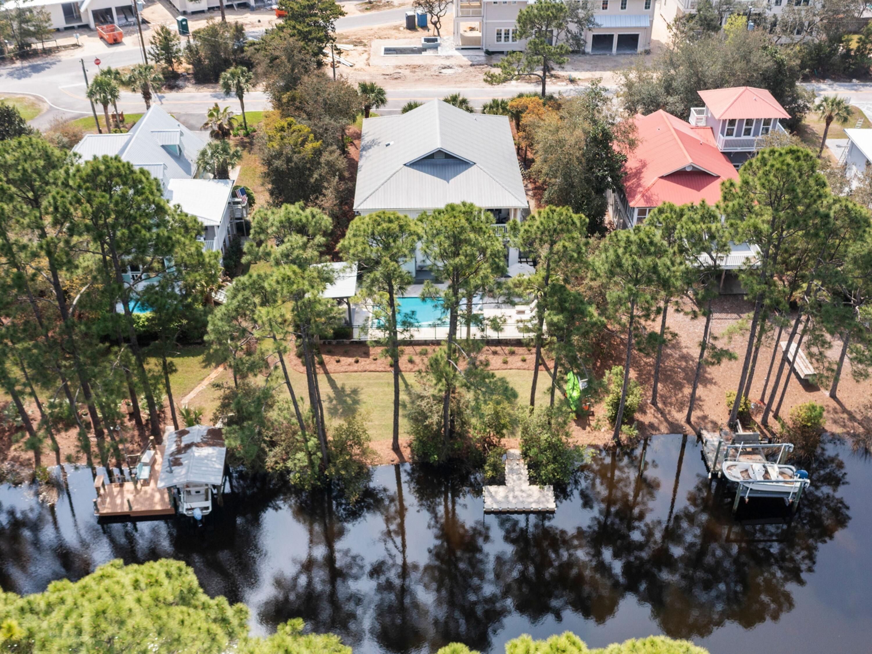 499 Lakeview Drive Santa Rosa Beach, FL 32459 - Photo 4 of 52 a aerial view of a house with a yard and lake view