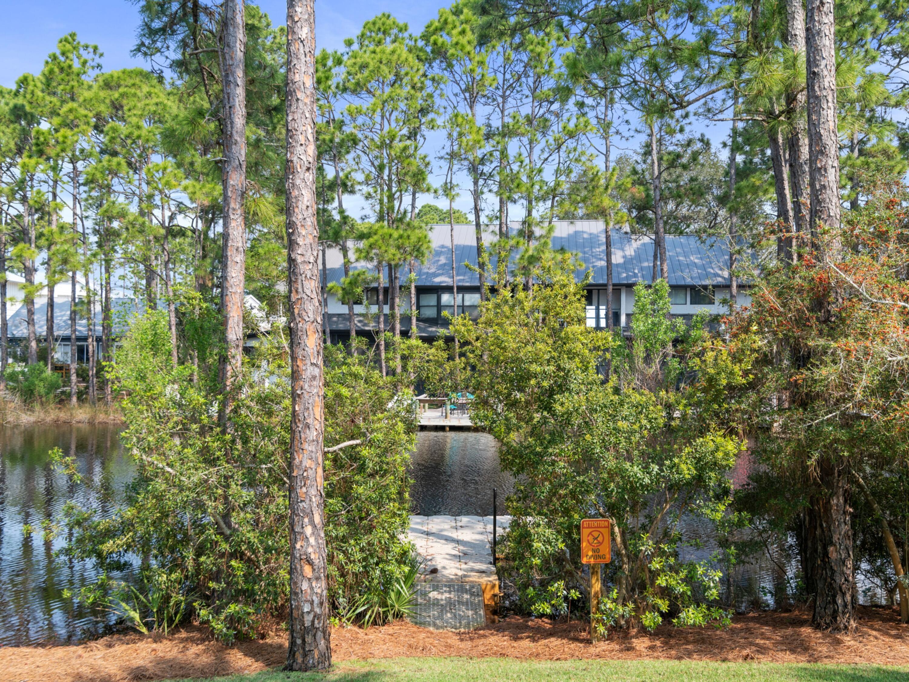 499 Lakeview Drive Santa Rosa Beach, FL 32459 - Photo 42 of 52 a aerial view of a house with a yard and large trees