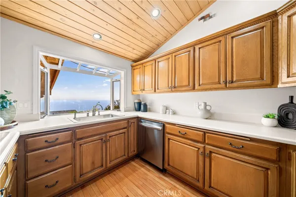 a kitchen with sink cabinets and window