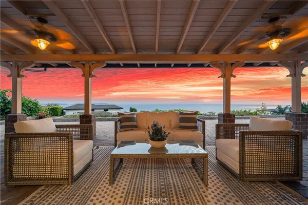 a balcony with furniture and a view of city