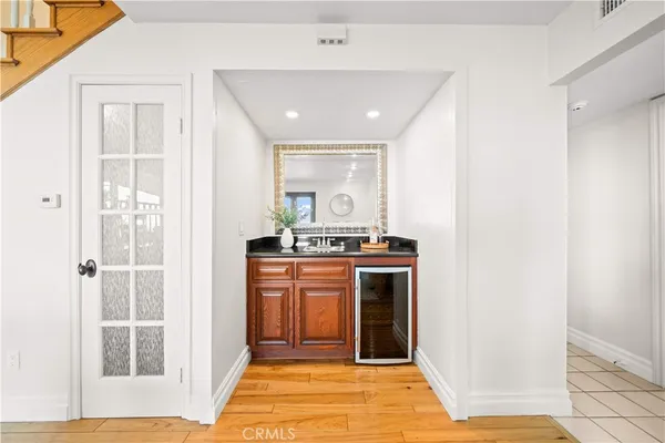 a view of a dining room with furniture and a kitchen