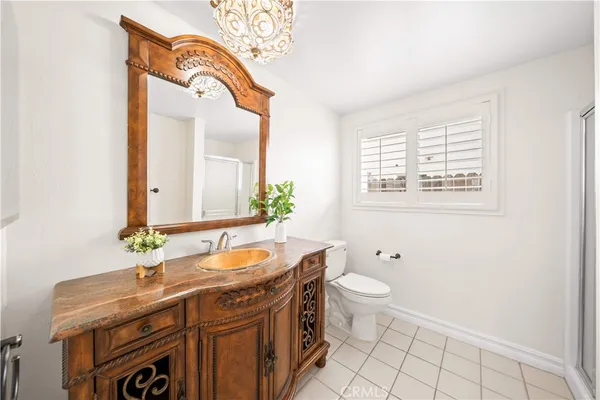 a bathroom with a glass shower door