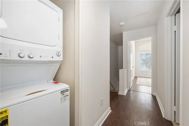 a view of washer and dryer with wooden floor