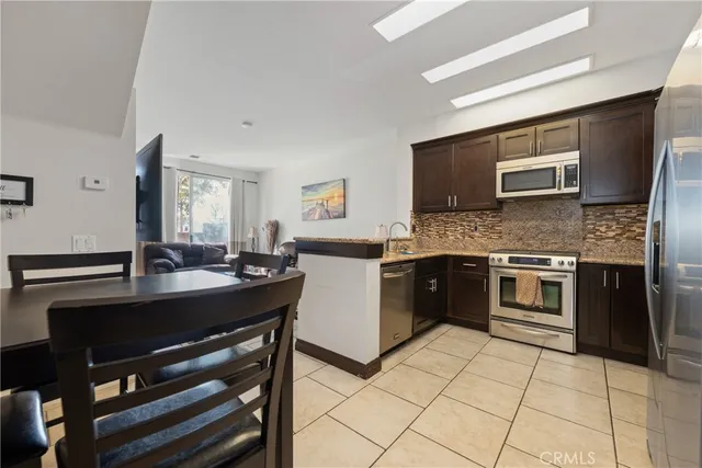 a kitchen with a stove and a microwave