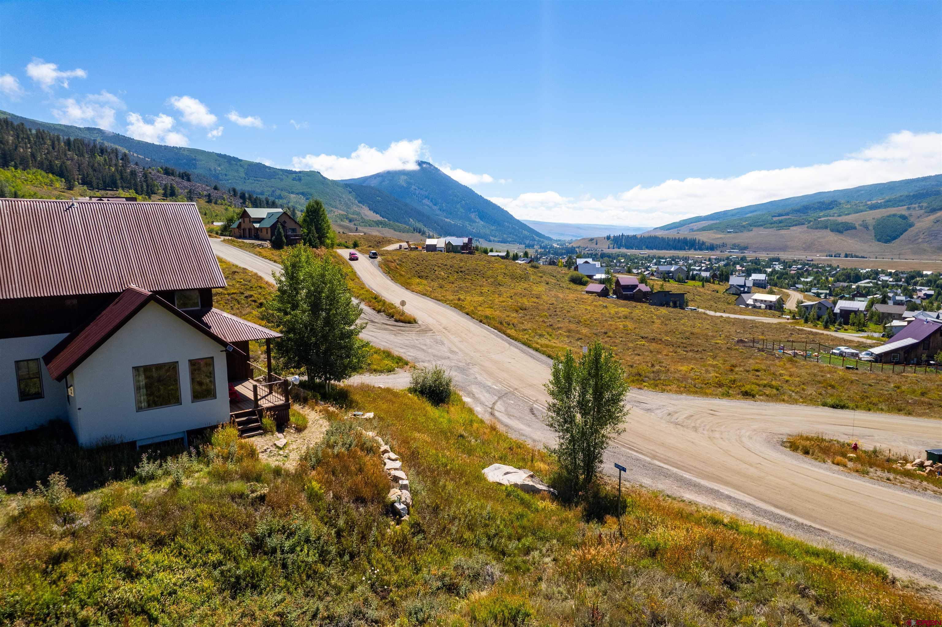 3726 Bryant Avenue Crested Butte, CO 81224 - Photo 21 of 43 a view of a house with a yard and lake view