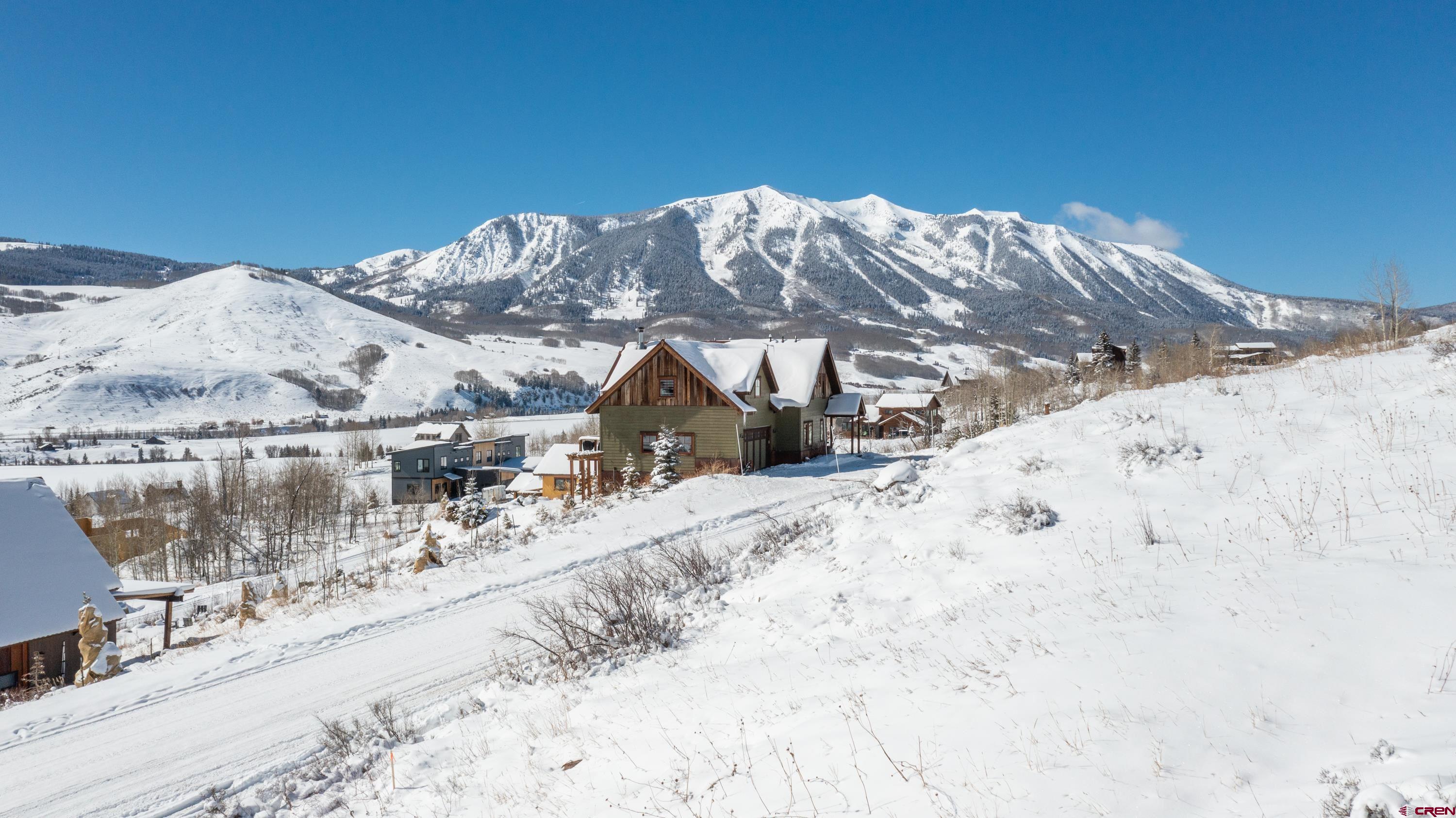 3726 Bryant Avenue Crested Butte, CO 81224 - Photo 6 of 43 a view of a house with a snow on the background