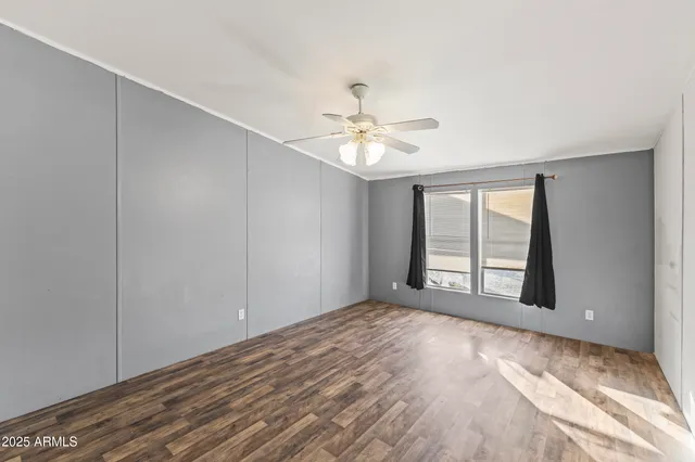 a view of empty room with window and fireplace