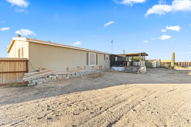 a view of a deck with furniture and wooden floor