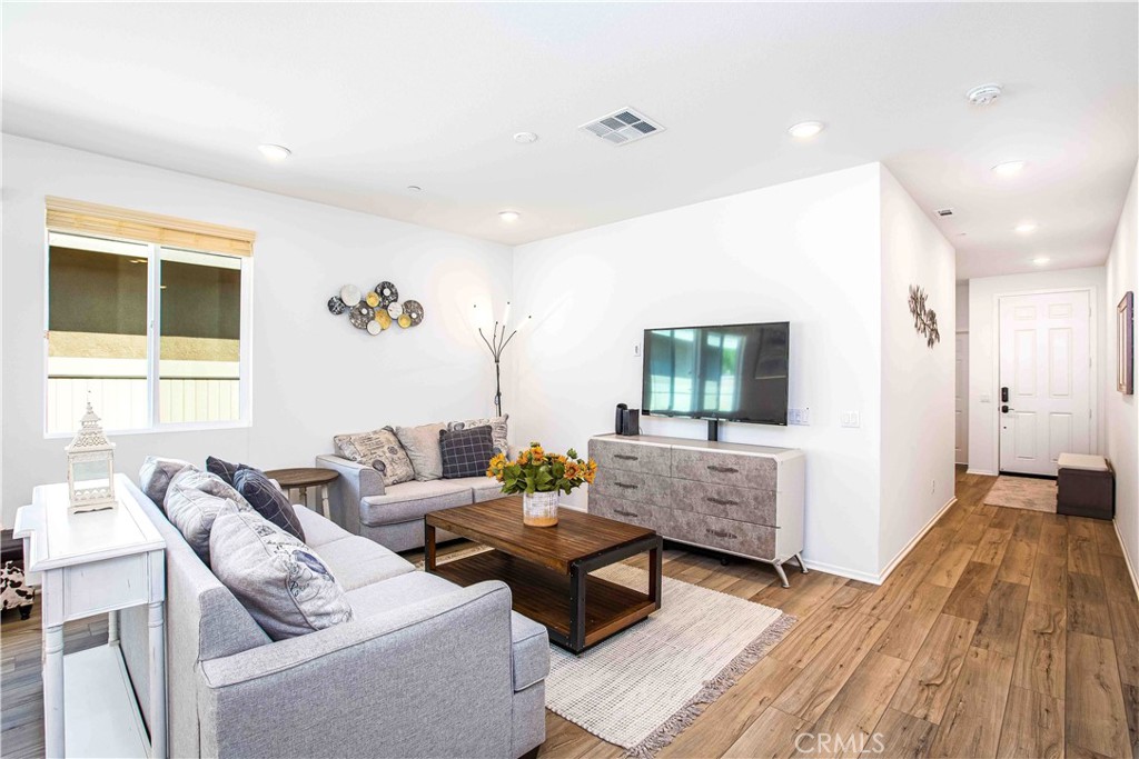 a living room with furniture and a window
