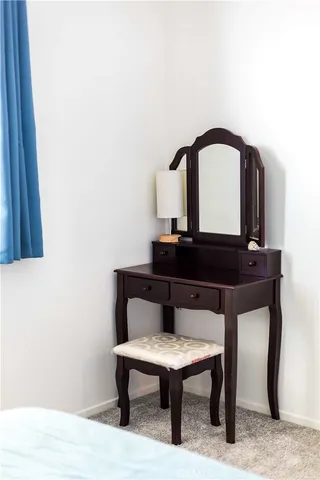 a room with a table and a potted plant