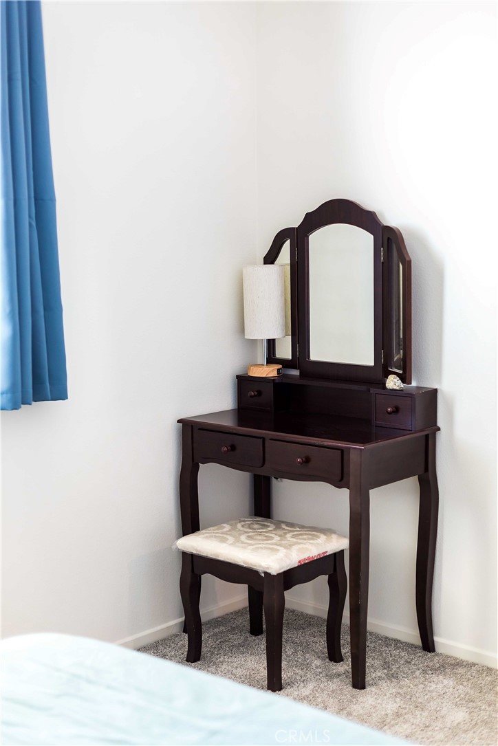 14563 Gulfstream Lane Moreno Valley, CA 92553 - Photo 16 of 30 a room with a table and a potted plant