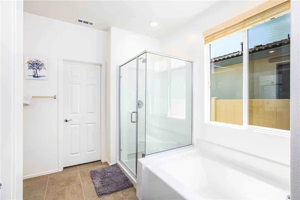 a bathroom with a shower and a sink