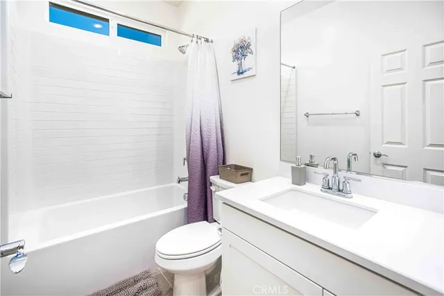 a bathroom with a sink a toilet and a bathtub