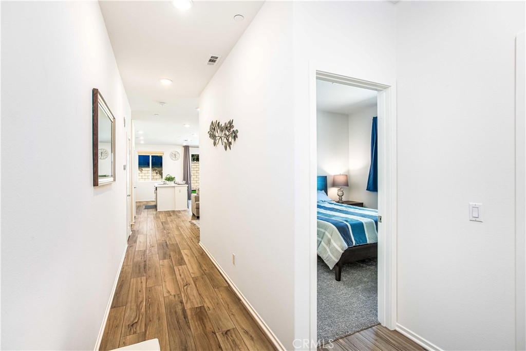 14563 Gulfstream Lane Moreno Valley, CA 92553 - Photo 22 of 30 a view of a hallway with a livingroom and a kitchen