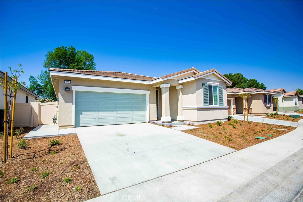 14563 Gulfstream Lane Moreno Valley, CA 92553 - Photo 27 of 30 a front view of a house with garden
