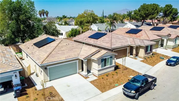 a view of a house with backyard porch and sitting area