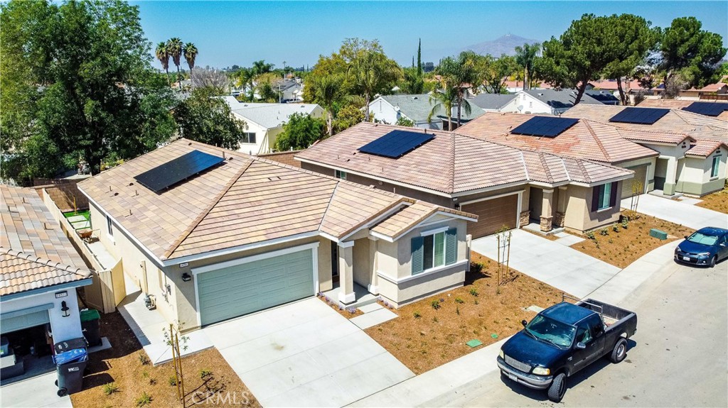 14563 Gulfstream Lane Moreno Valley, CA 92553 - Photo 28 of 30 a view of a house with backyard porch and sitting area
