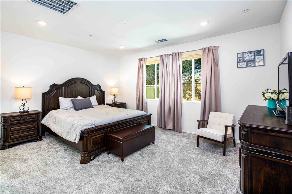 14563 Gulfstream Lane Moreno Valley, CA 92553 - Photo 10 of 30 a bedroom with a bed and wooden floor
