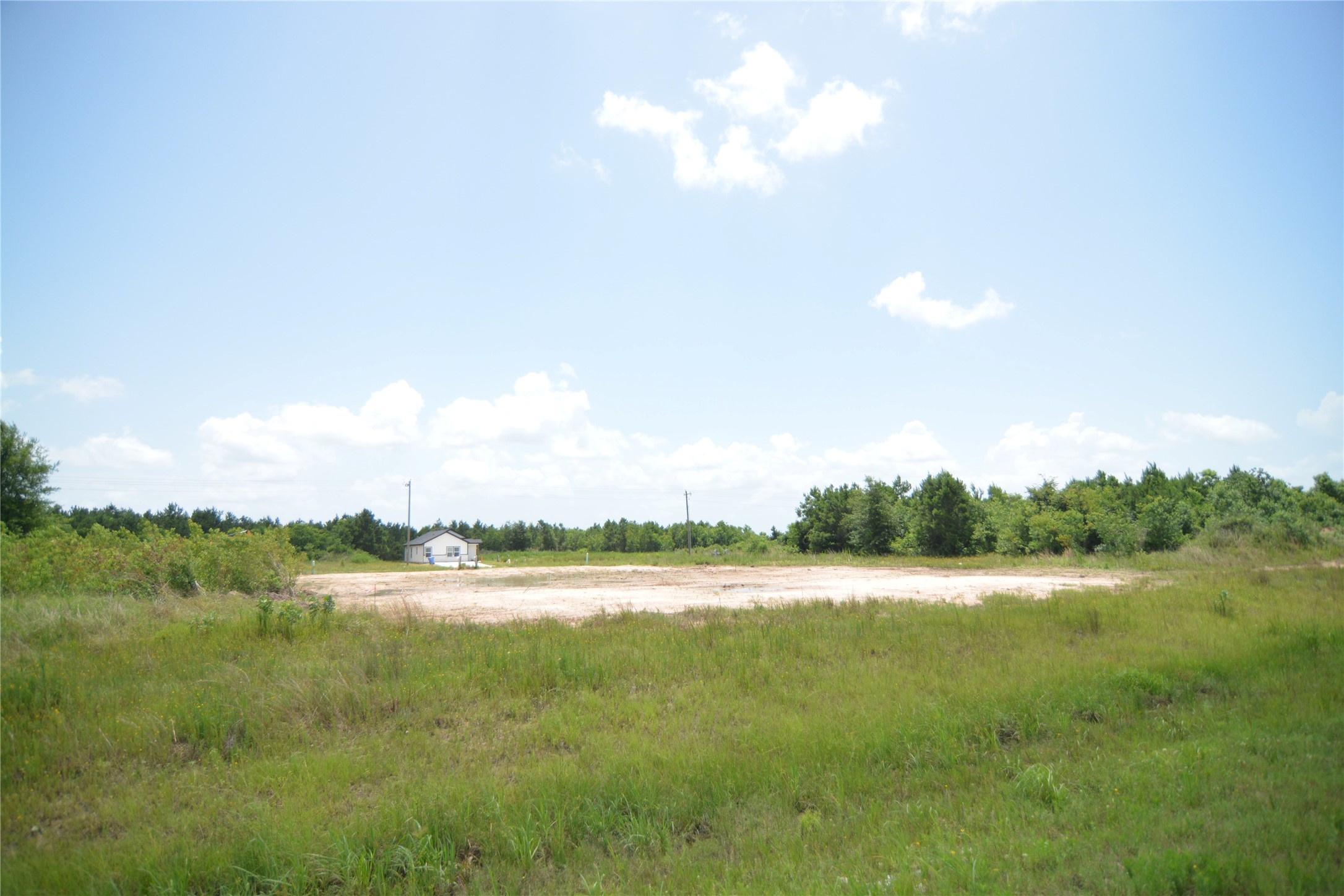 7715 Amanda Road Cleveland, TX 77327 - Photo 13 of 16 a view of a lake and a yard
