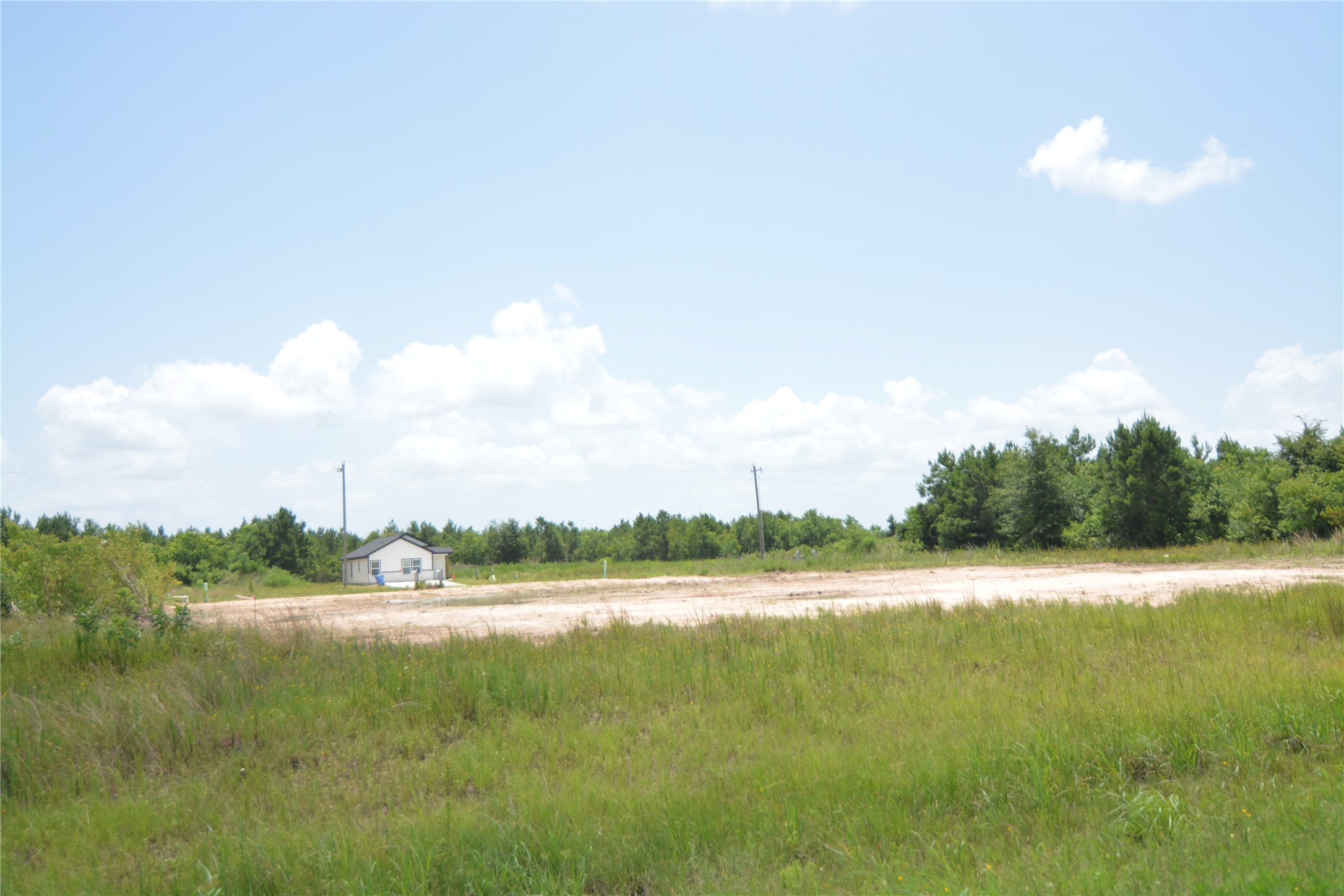 7715 Amanda Road Cleveland, TX 77327 - Photo 16 of 16 a view of a lake with outdoor space
